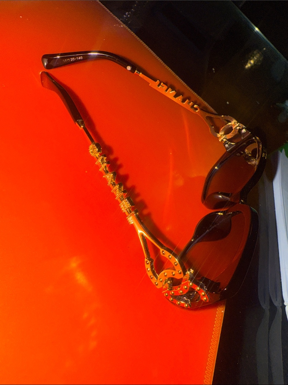 CHANEL Black Sunglasses with Gold Chain-Style Temples